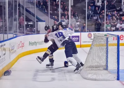 Image of two hockey players engaged in a fighe at Kwings vs Wheeling game
